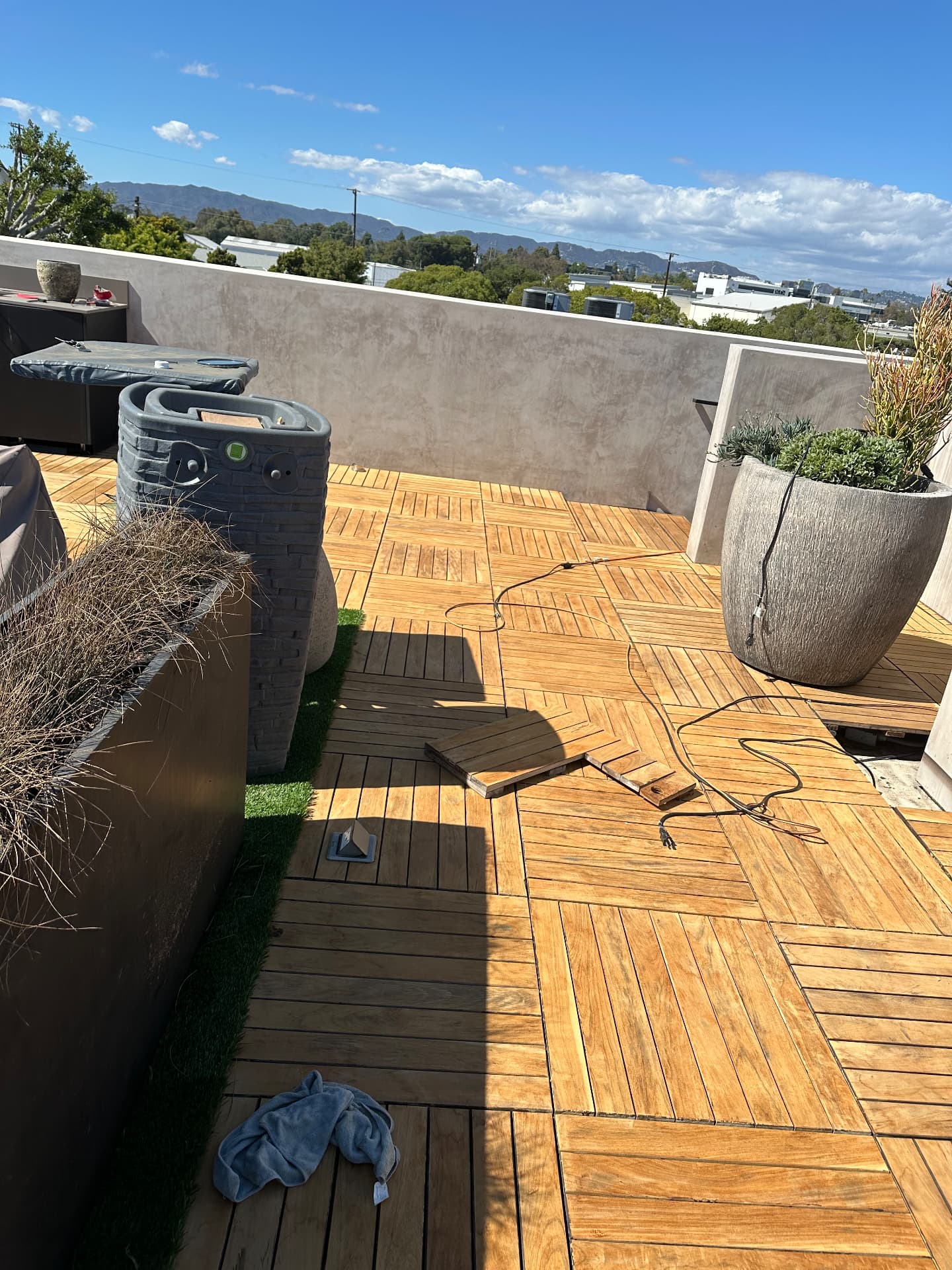 Rooftop teak terrace refinishing before