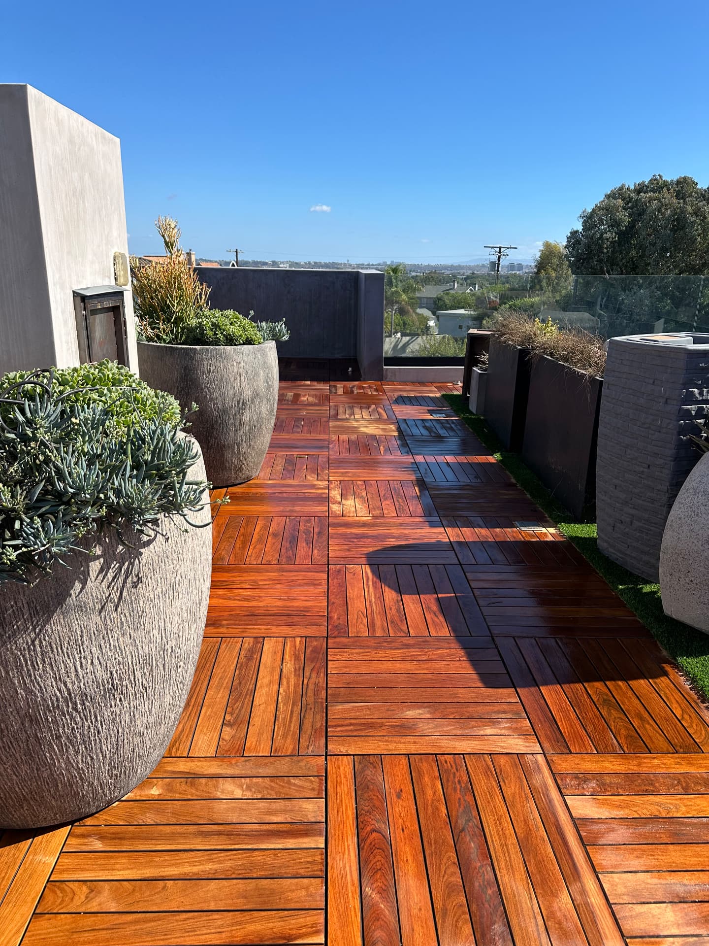 Rooftop teak terrace refinishing after